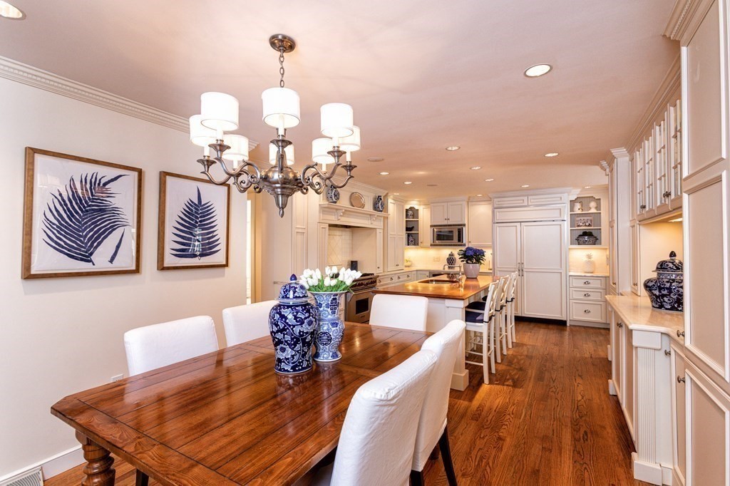 44 Eaton Road Lexington, MA 02420 - Photo 5 of 24 a view of a dining room with furniture a chandelier and wooden floor