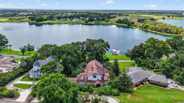 an aerial view of lake residential houses with outdoor space and lake view