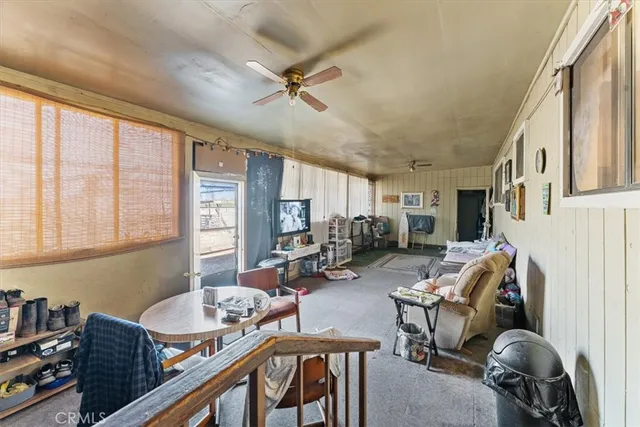 a living room with furniture rug and a window