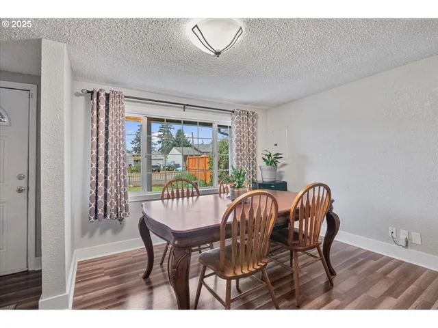a view of a dining room with furniture window and outside view