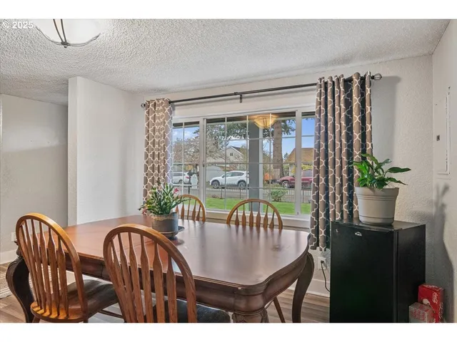 a view of a dining room with furniture window and outside view