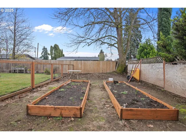 a view of a patio with a table and chairs