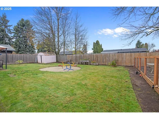 a view of a house with backyard porch and furniture