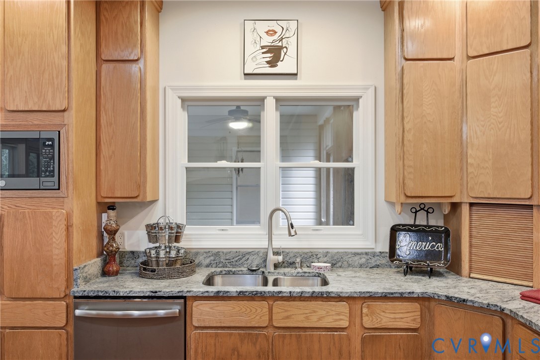 13265 Coulbourn Road Saluda, VA 23149 - Photo 12 of 62 a kitchen with granite countertop a sink and a window
