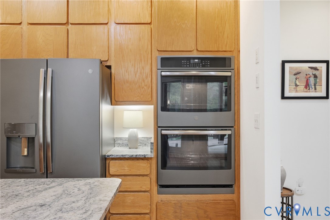 13265 Coulbourn Road Saluda, VA 23149 - Photo 13 of 62 a kitchen with stainless steel appliances granite countertop a refrigerator and a stove