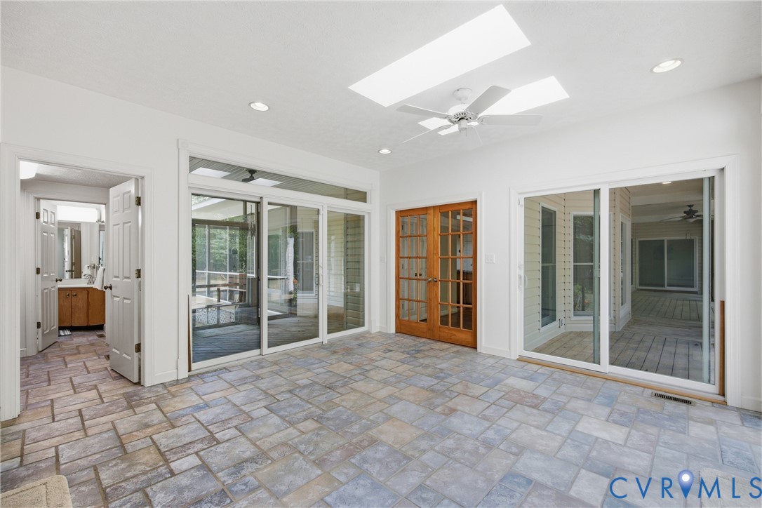 13265 Coulbourn Road Saluda, VA 23149 - Photo 14 of 62 Spacious room featuring multi-tone paver tile floo