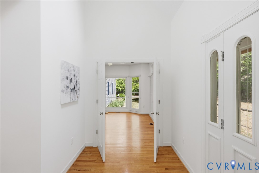 13265 Coulbourn Road Saluda, VA 23149 - Photo 18 of 62 a view of hallway with window and wooden floor