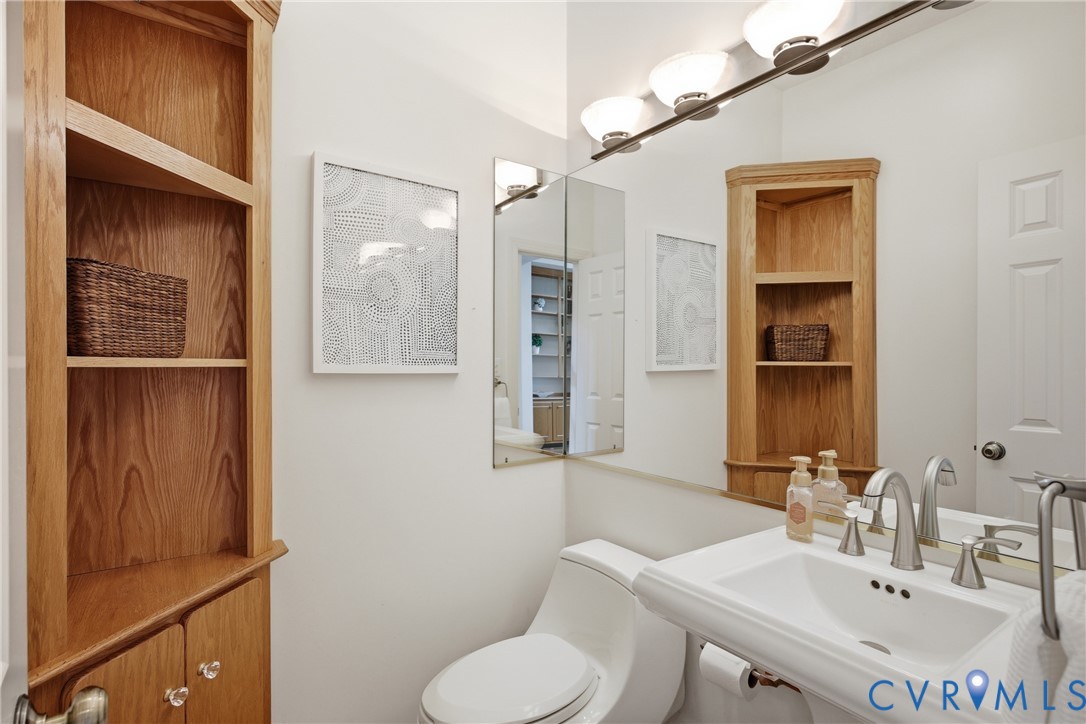 13265 Coulbourn Road Saluda, VA 23149 - Photo 22 of 62 a bathroom with a sink toilet and shower