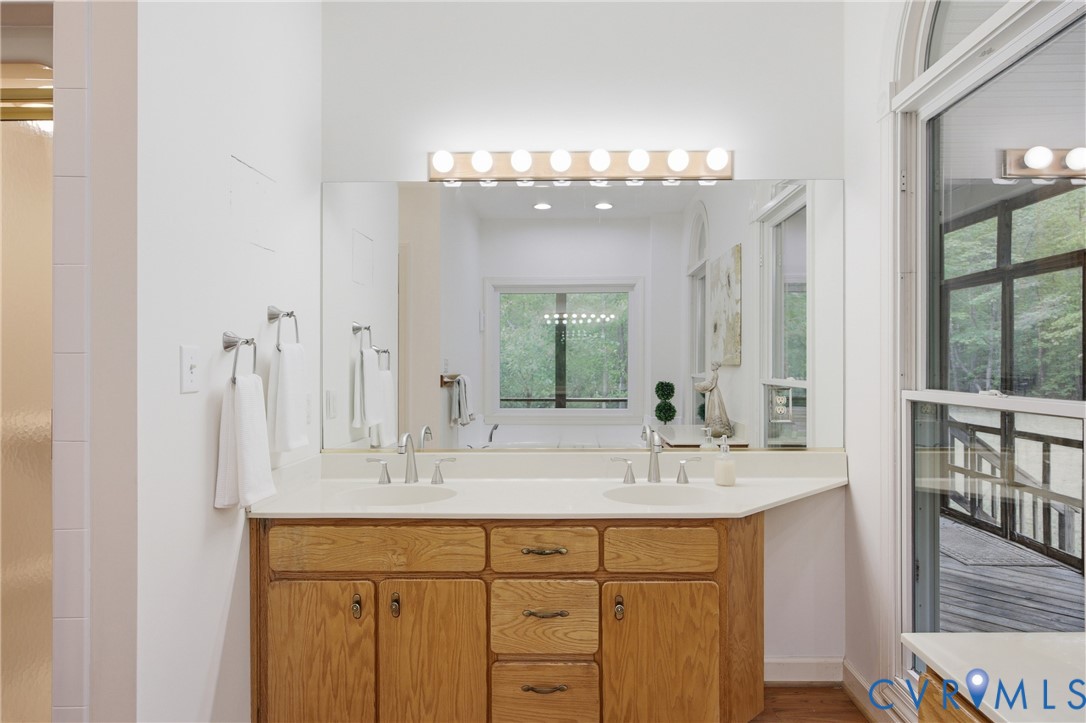 13265 Coulbourn Road Saluda, VA 23149 - Photo 26 of 62 a bathroom with a sink double vanity and a mirror