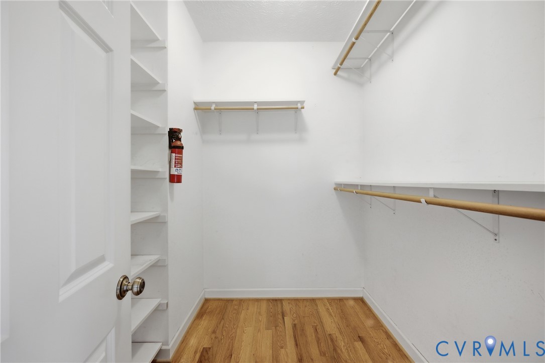 13265 Coulbourn Road Saluda, VA 23149 - Photo 28 of 62 a view of walk in closet with clothes and shoes