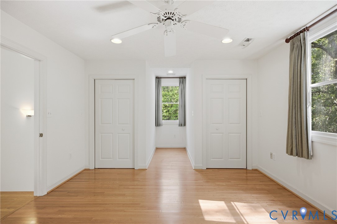 13265 Coulbourn Road Saluda, VA 23149 - Photo 32 of 62 an empty room with windows and closet