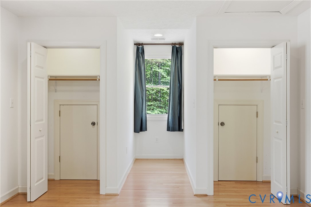 13265 Coulbourn Road Saluda, VA 23149 - Photo 36 of 62 Hallway featuring wood-finish flooring and a centr