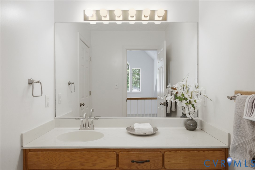13265 Coulbourn Road Saluda, VA 23149 - Photo 38 of 62 a bathroom with a sink and a mirror