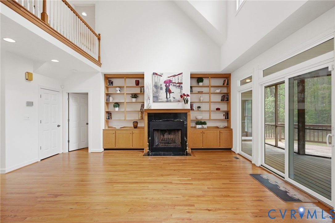 13265 Coulbourn Road Saluda, VA 23149 - Photo 4 of 62 a living room with furniture a fireplace and a large window
