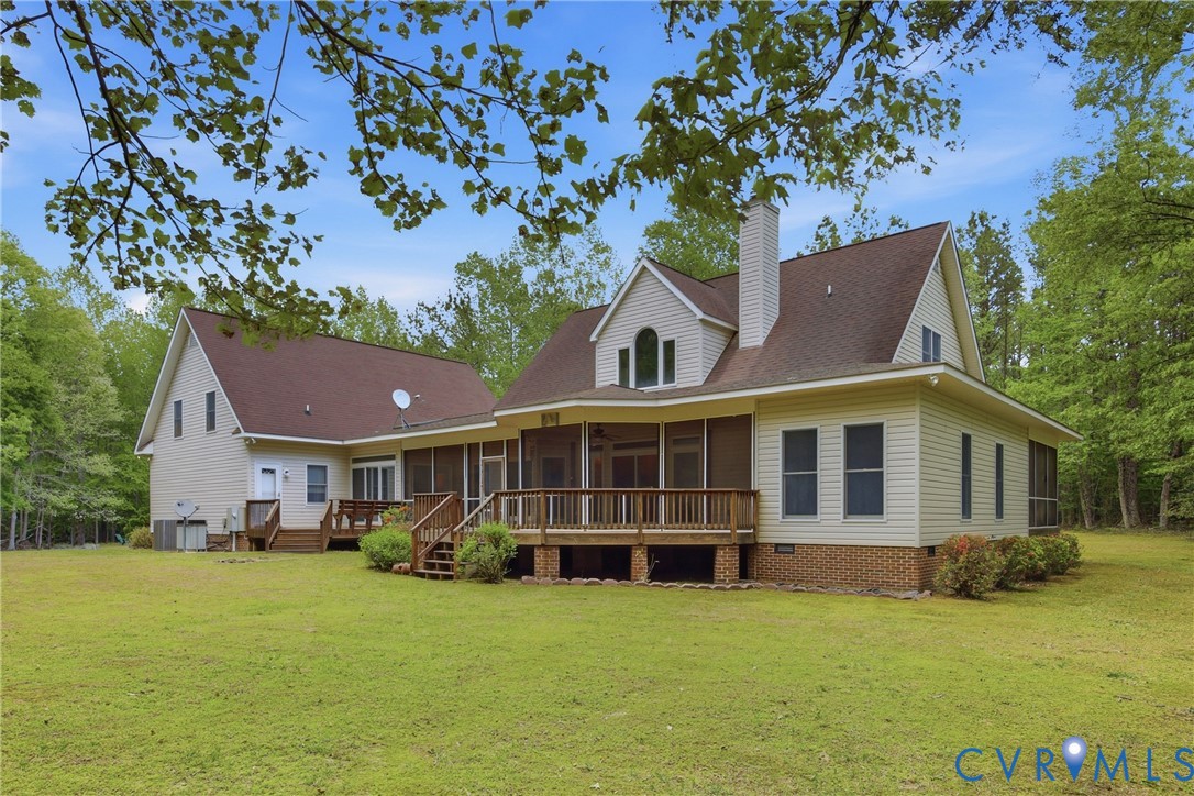 13265 Coulbourn Road Saluda, VA 23149 - Photo 49 of 62 a view of a house with a backyard