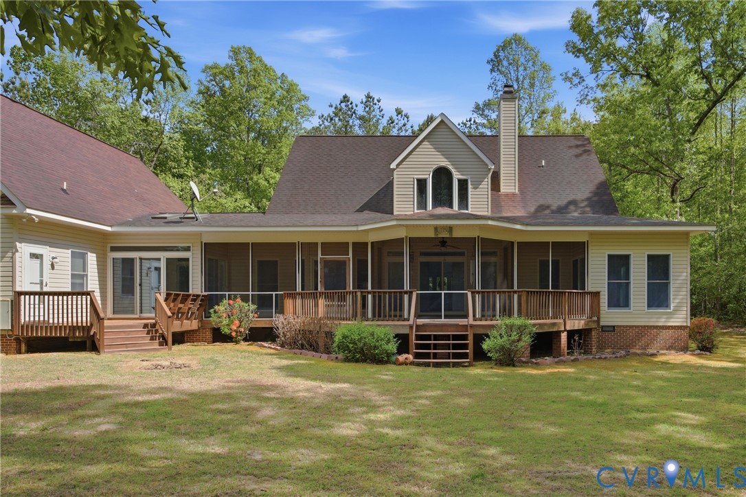 13265 Coulbourn Road Saluda, VA 23149 - Photo 50 of 62 a front view of a house with a yard patio and fire pit