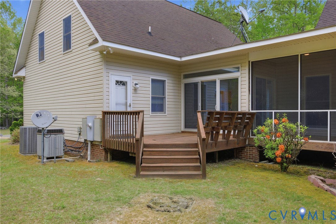 13265 Coulbourn Road Saluda, VA 23149 - Photo 51 of 62 a view of a house with a bed and a chair