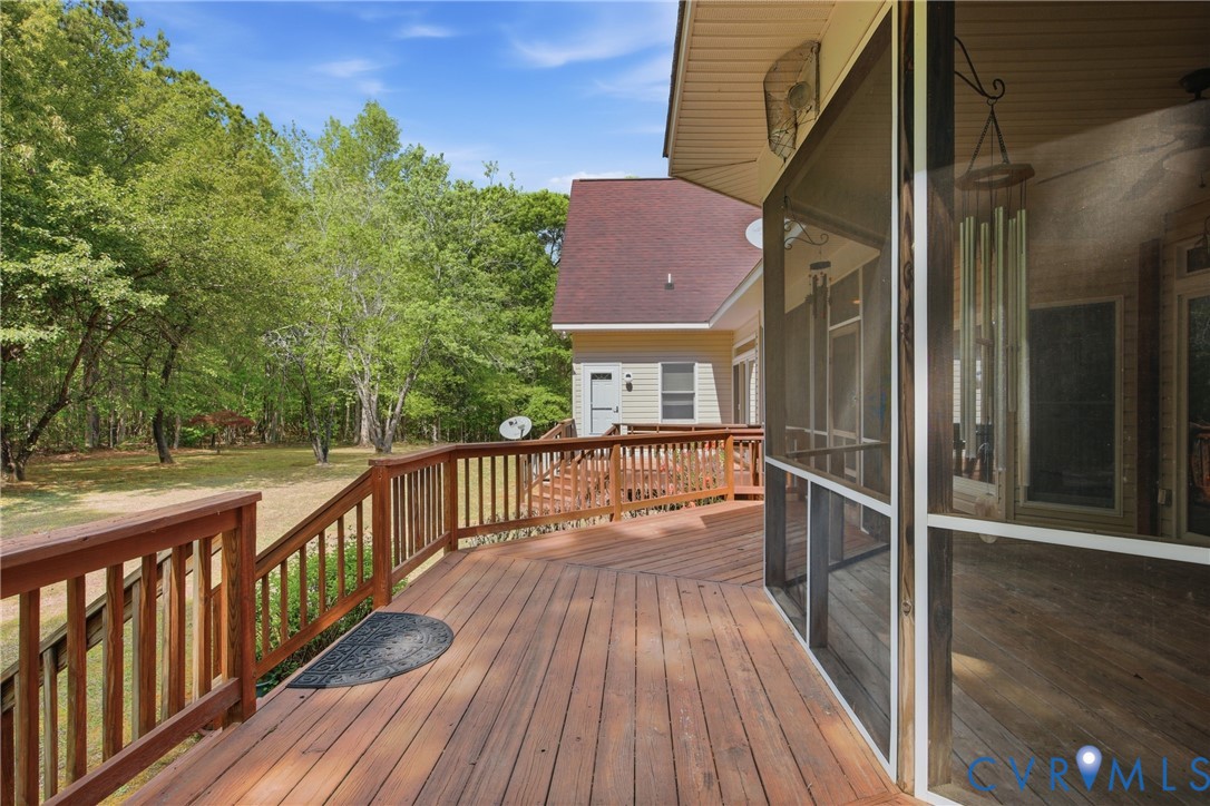 13265 Coulbourn Road Saluda, VA 23149 - Photo 53 of 62 Spacious wood-finish deck with railing extending t