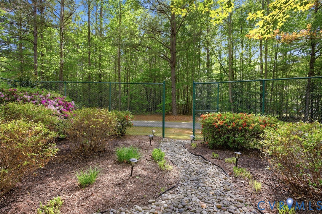 13265 Coulbourn Road Saluda, VA 23149 - Photo 56 of 62 Landscaped garden path with river rock leading to