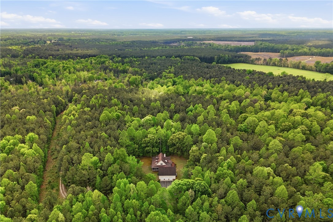 13265 Coulbourn Road Saluda, VA 23149 - Photo 58 of 62 a view of a city with lush green forest