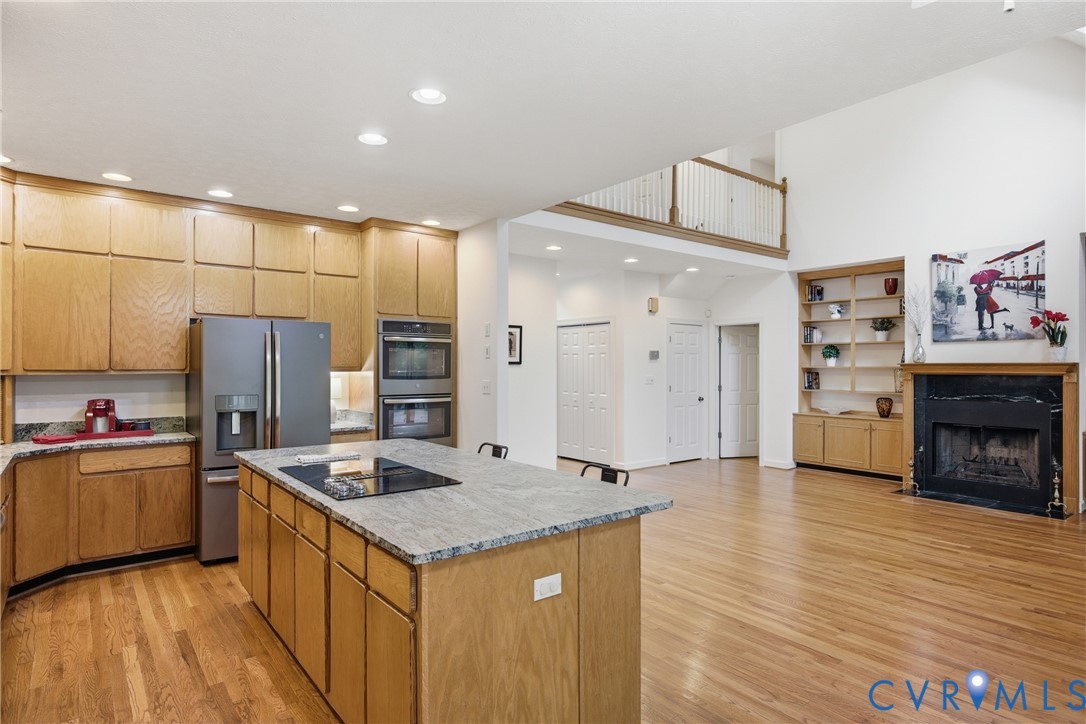 13265 Coulbourn Road Saluda, VA 23149 - Photo 6 of 62 a kitchen with stainless steel appliances granite countertop a refrigerator and a stove top oven