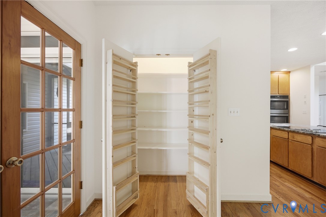 13265 Coulbourn Road Saluda, VA 23149 - Photo 8 of 62 a view of walk in closet with empty racks