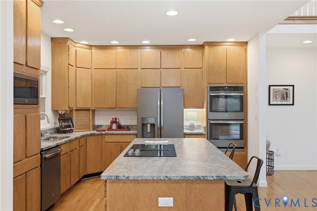 13265 Coulbourn Road Saluda, VA 23149 - Photo 10 of 62 Kitchen featuring extensive wood cabinetry, an isl