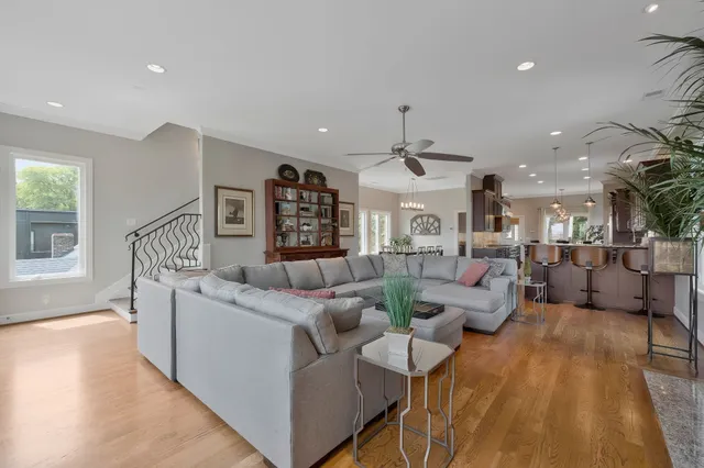 a bathroom with a granite countertop sink a large mirror and a dining table