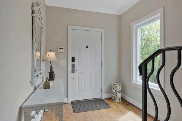 a bedroom with a bed a couch and a window