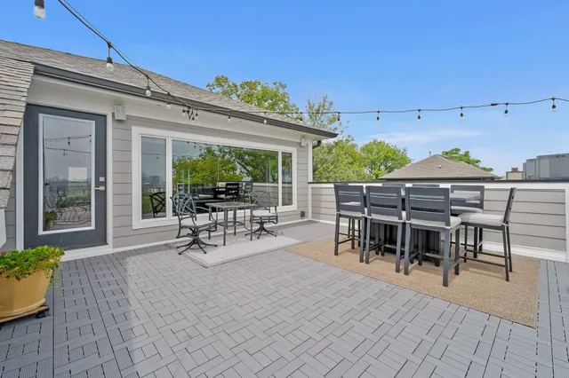 a spacious bathroom with a granite countertop sink and a mirror