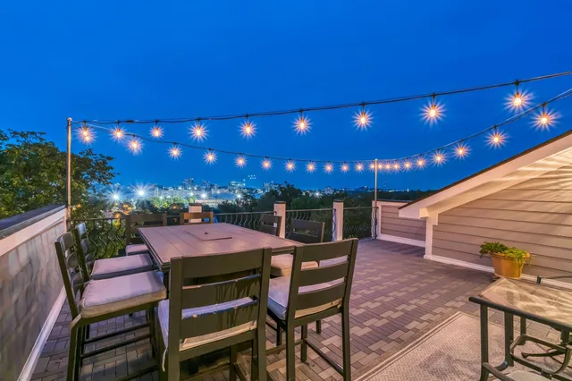 a bathroom with a tub a sink and mirror