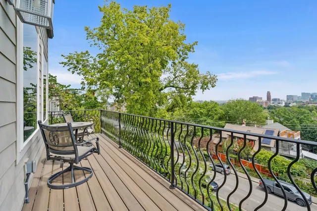 a bedroom that has a bed and a table in it