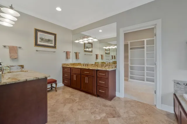 a balcony with table and chairs