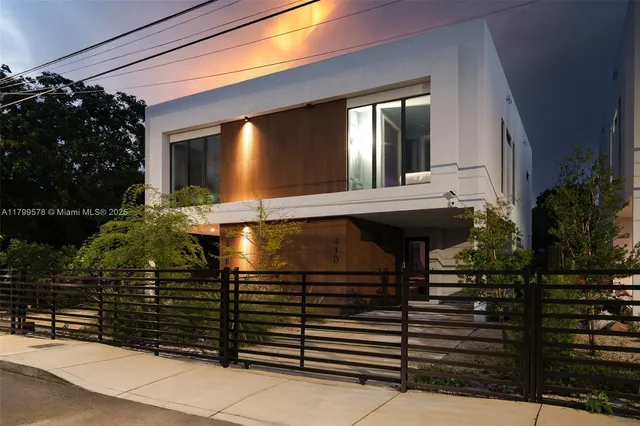 a view of a house with a small yard