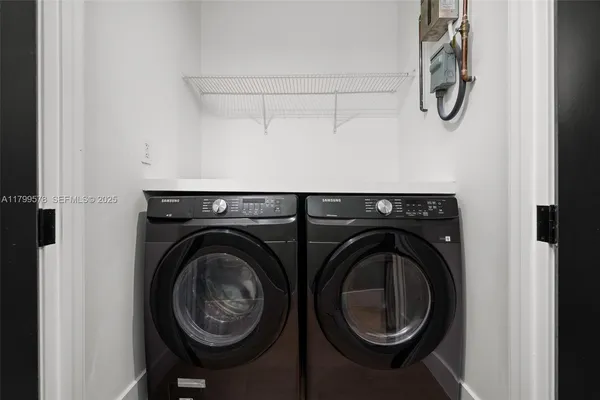 a utility room with dryer and washer