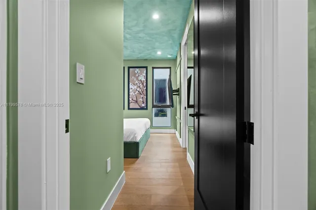 a bedroom with a large bed and a window