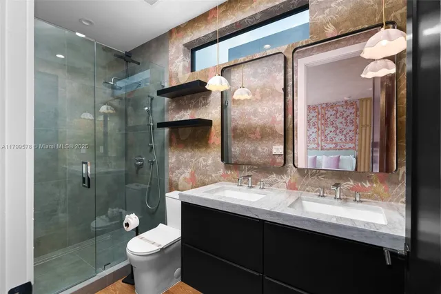 a bathroom with a sink vanity and a mirror
