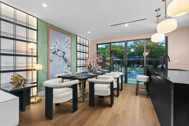 a kitchen with stainless steel appliances granite countertop a sink a oven and a large window