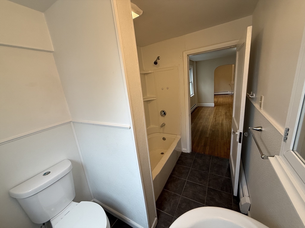 84 Emerald Road, Unit 1 Rutland, MA 01543 - Photo 8 of 22 a bathroom with a toilet sink and a mirror