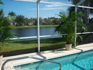 4648 Ossabaw Way Naples, FL 34119 - Photo 2 of 3 a view of a lake view with a garden