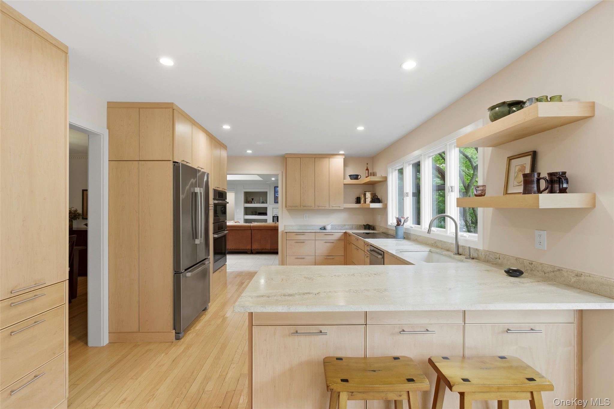 7 Gun Path Setauket, NY 11733 - Photo 13 of 34 a kitchen with stainless steel appliances granite countertop a refrigerator and a sink