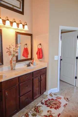 a bathroom with bathtub and window