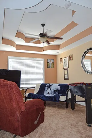 a bathroom with a toilet and a shower curtain