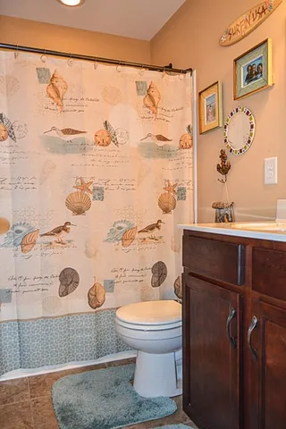 a bedroom with bed and a window