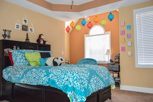 a bedroom with a bed and dresser