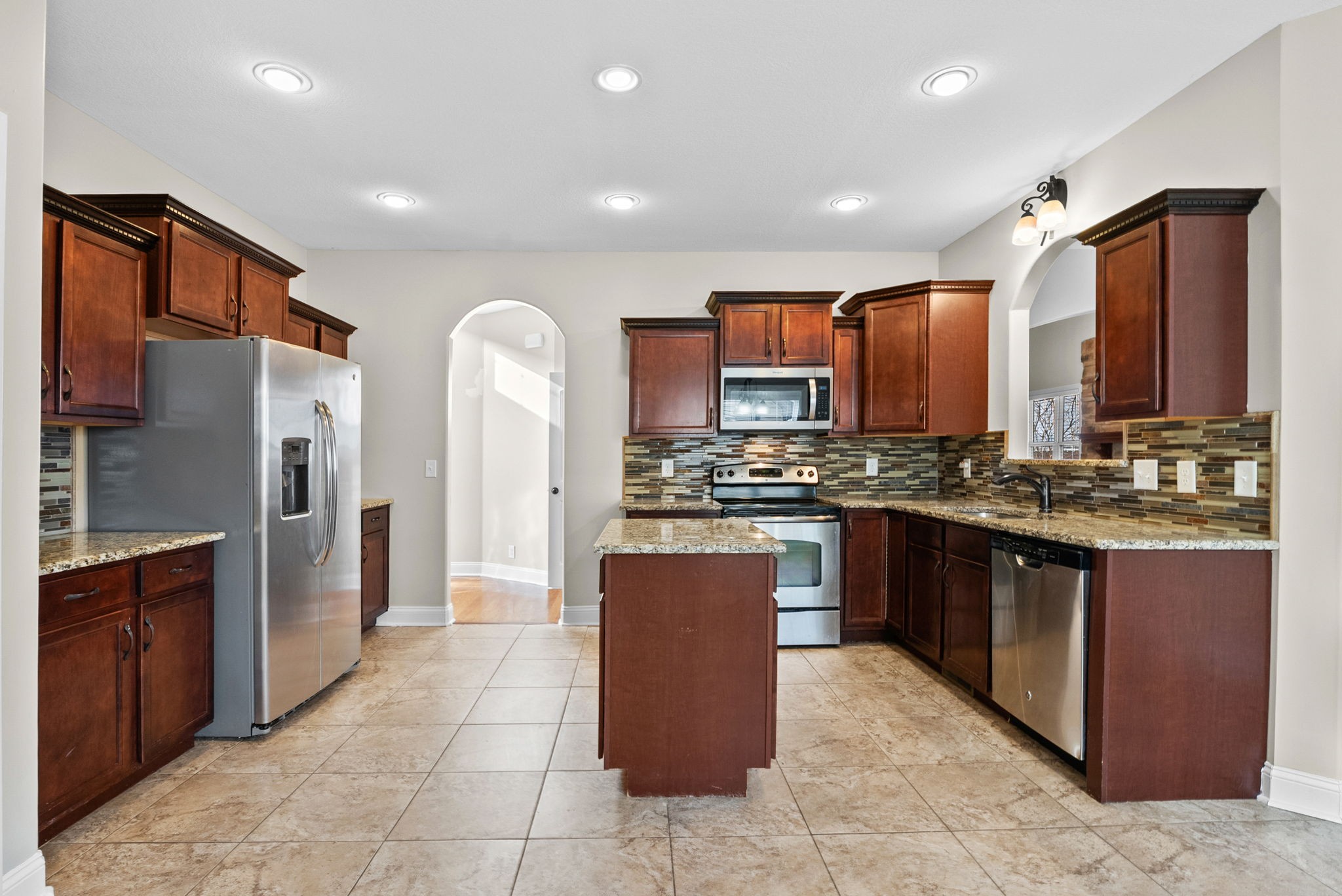 1900 Apache Way Clarksville, TN 37042 - Photo 20 of 50 a large kitchen with stainless steel appliances granite countertop a refrigerator and a stove