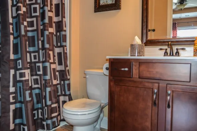 a view of a backyard with table and chairs under an umbrella
