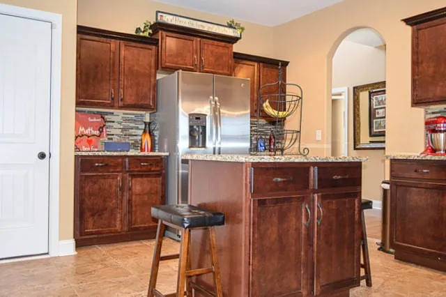 a bathroom with a sink a mirror and a shower