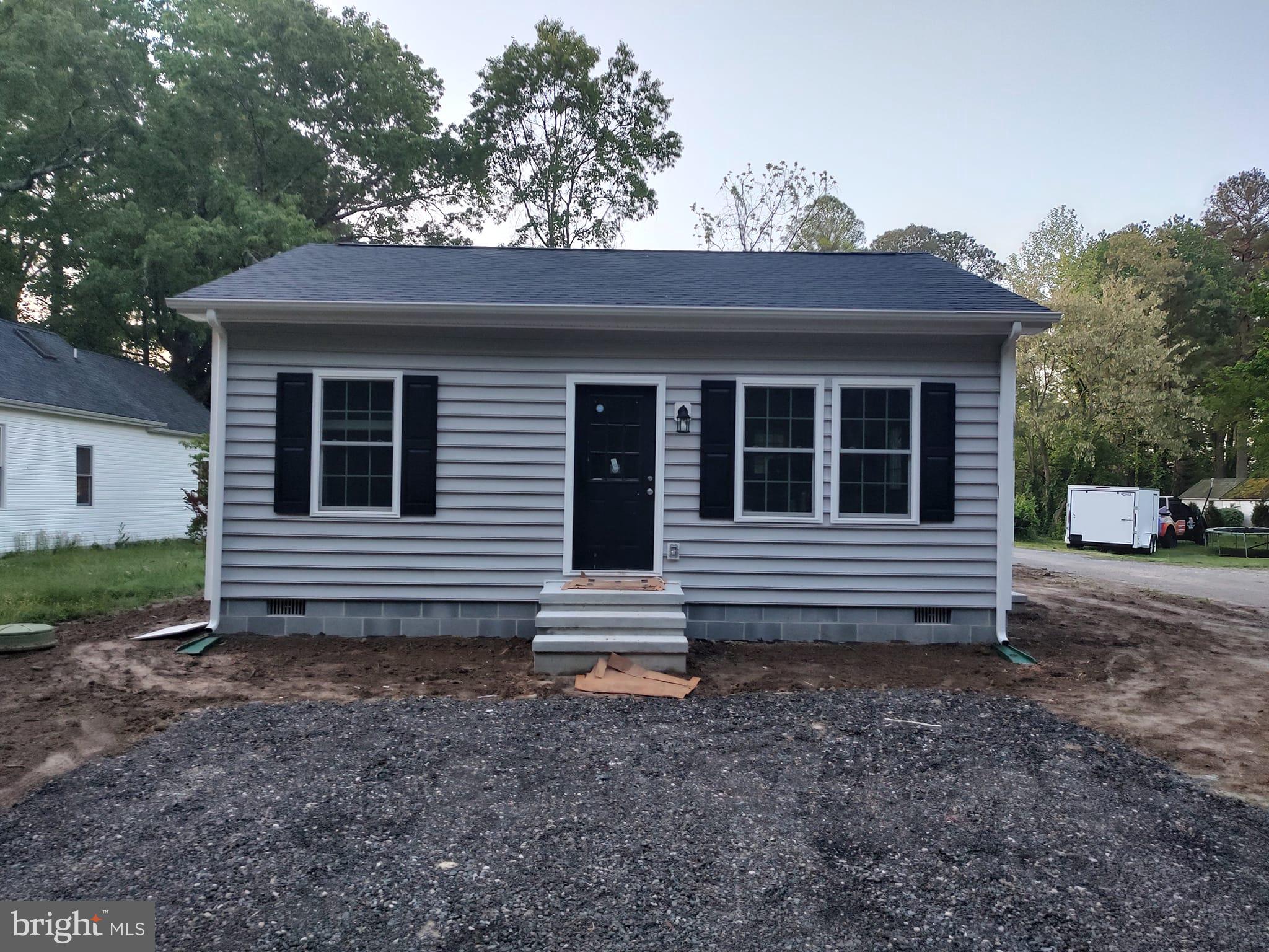 10103 Copperville Road Easton, MD 21601 - Photo 1 of 5 a view of a house with a window and wooden fence