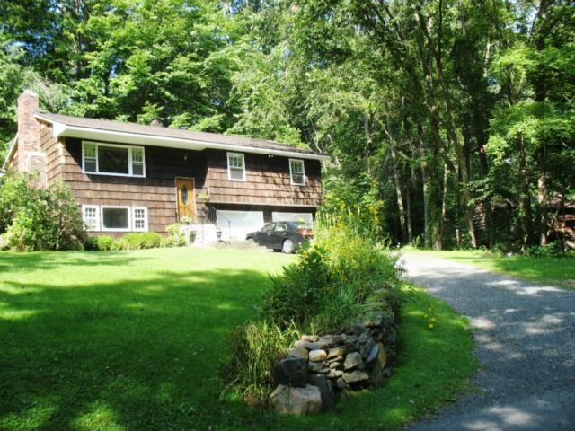 71 Shady Lane Ridgefield, CT 06877 - Photo 1 of 1 a front view of a house with garden